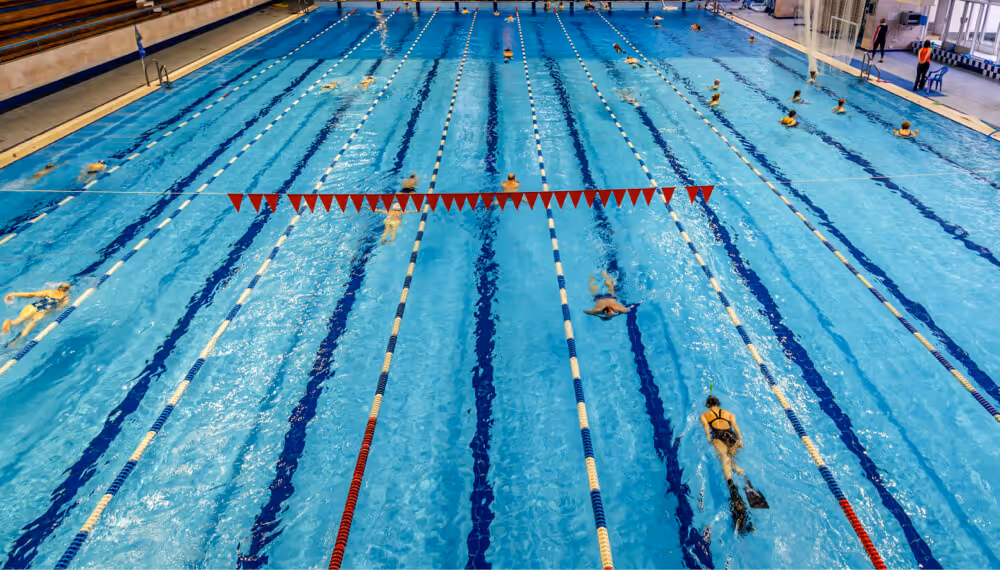 group of men playing basketball in a gym