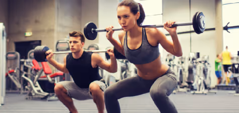 women lifting weights at rec center