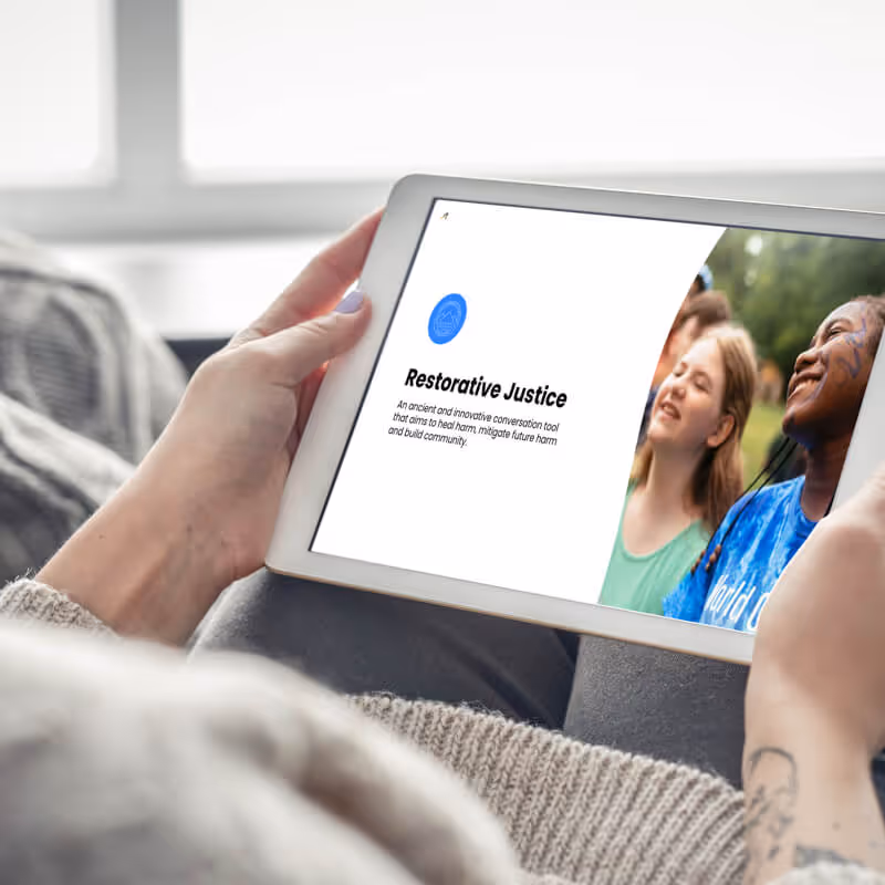 watching restorative justice webinar recording on a tablet