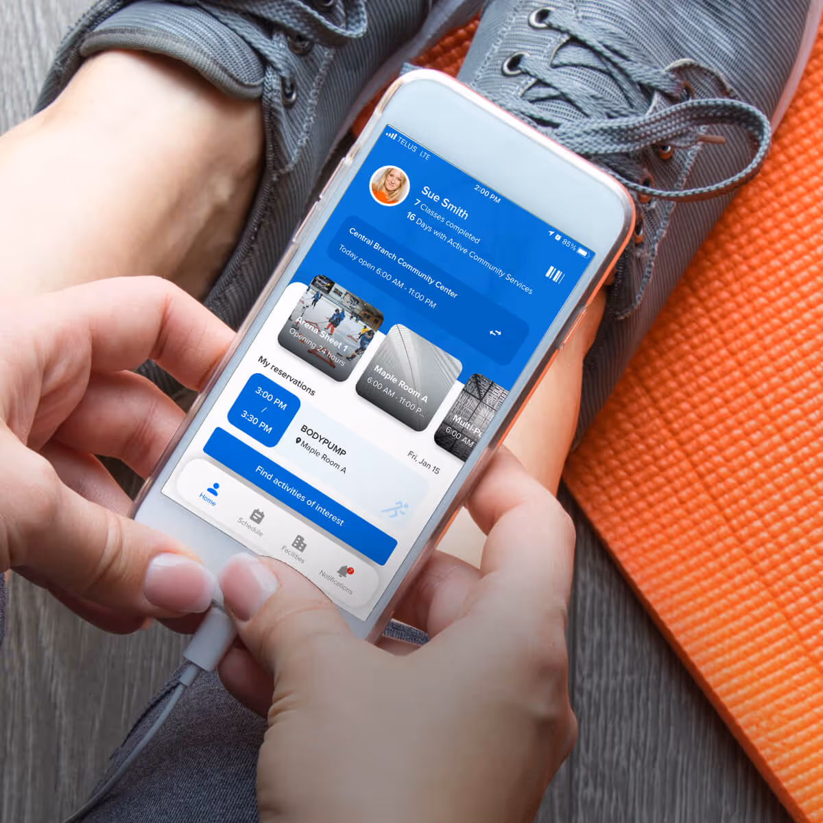 person at gym using active captivate app to register for a class