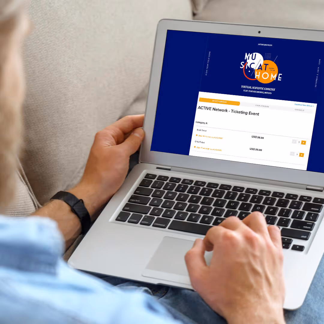 Man registering for a concert on his laptop