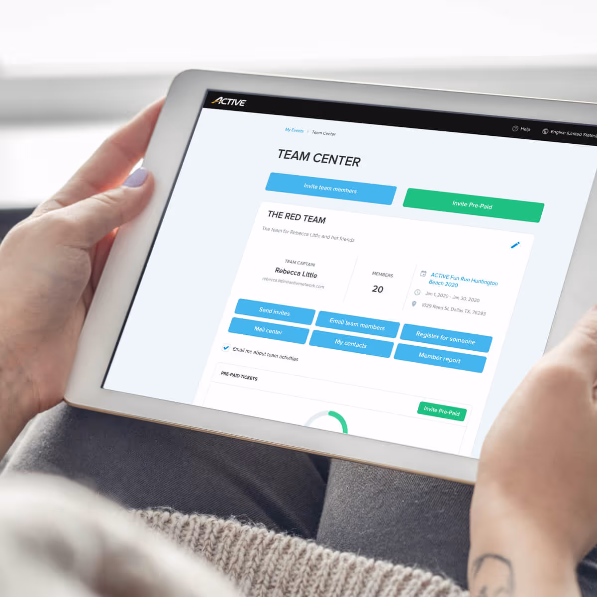person holding tablet looking at her MyEvents team center dashboard