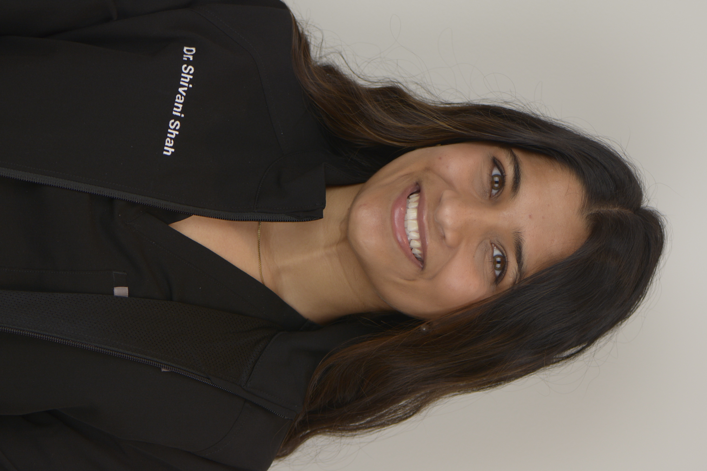 Photo of Dr. Lilya showing a photo to a patient