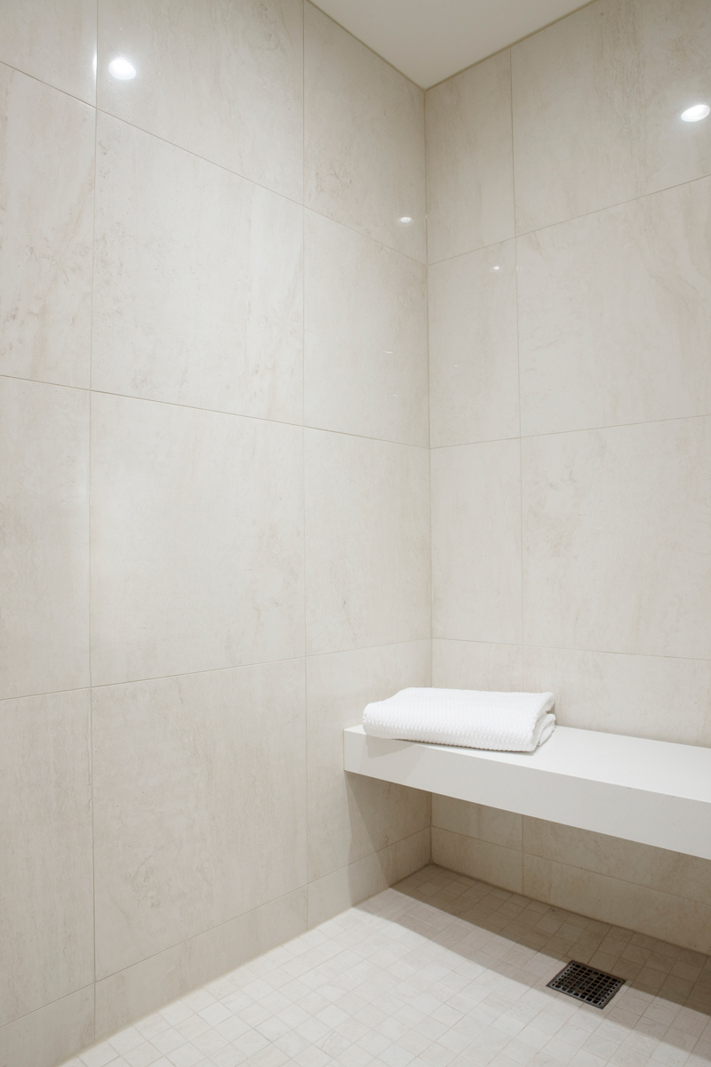 Bay Street Condo: The spacious bathroom features a generous shower with built-in bench seat