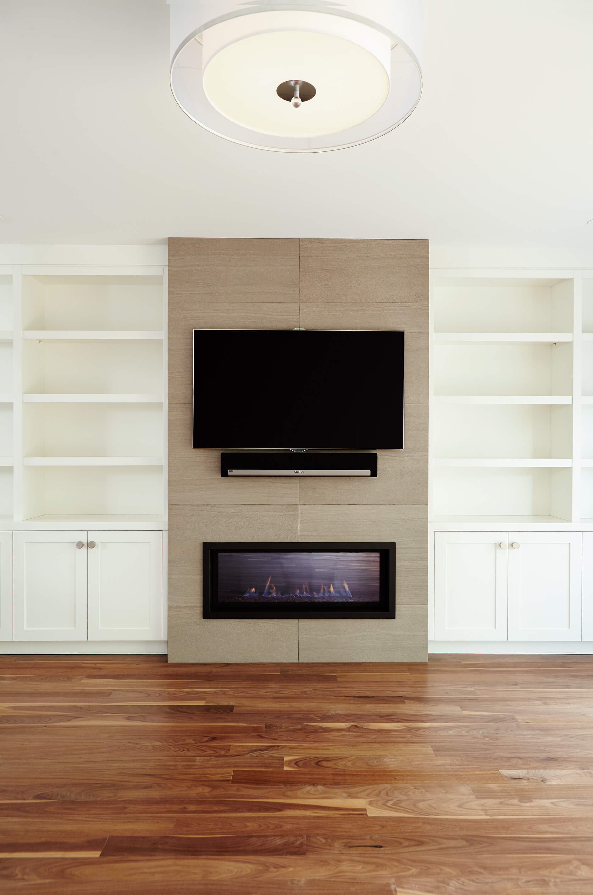 Bedford Park: The use of walnut on the island also builds momentum up from the walnut floor for maximum flow in an open concept space