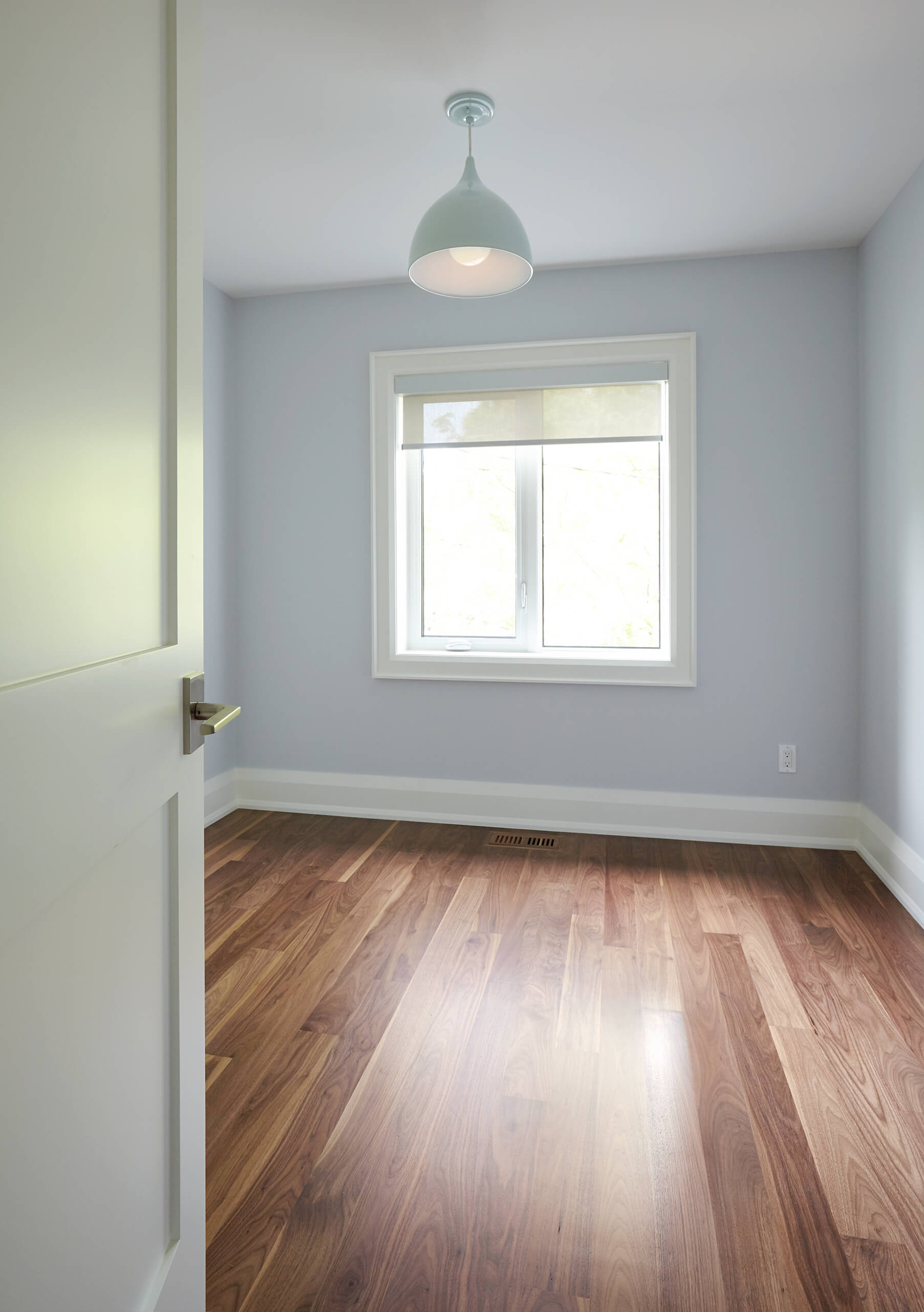 Bedford Park: The use of walnut on the island also builds momentum up from the walnut floor for maximum flow in an open concept space