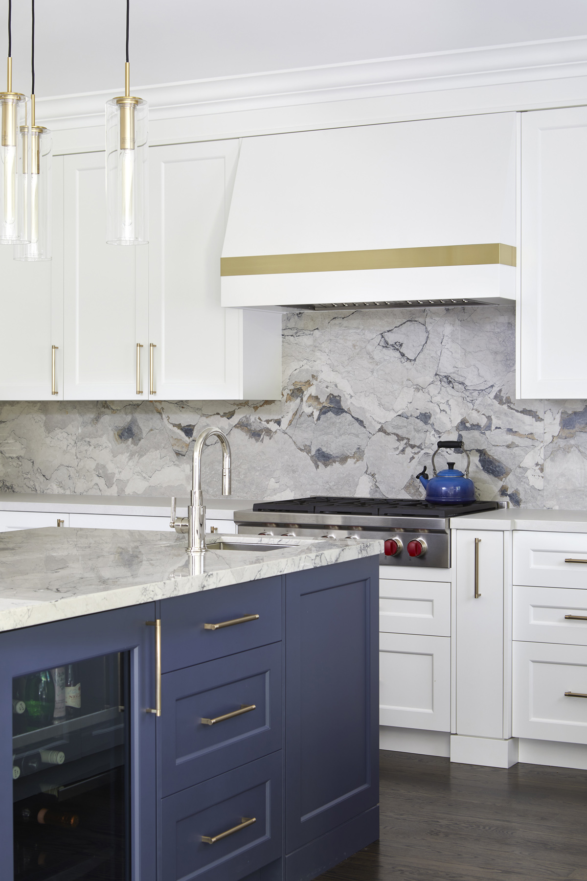 Humber Valley Village: The kitchen was totally reimagined and designed to incorporate all of the clients needs from and oversized panel ready Sub Zero, spacious island with prep sink and wine storage, floor to ceiling pantry, endless drawer space,…