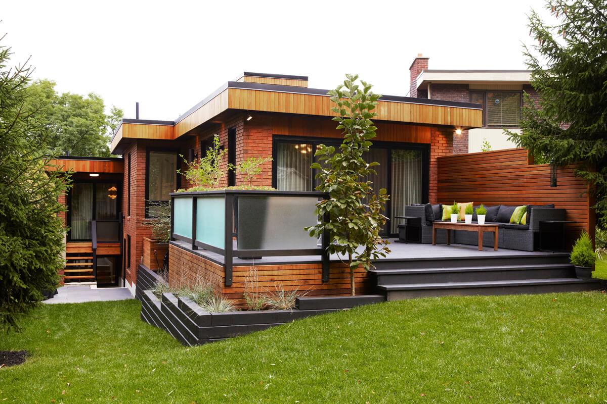 West Toronto: Challenges included removing an elevator, leveling and resurfacing over 3000sq/ft of flat roof, replacing all windows including the addition of a 20 ft curtain window, raising the ceilings and installing solid walnut plank flooring