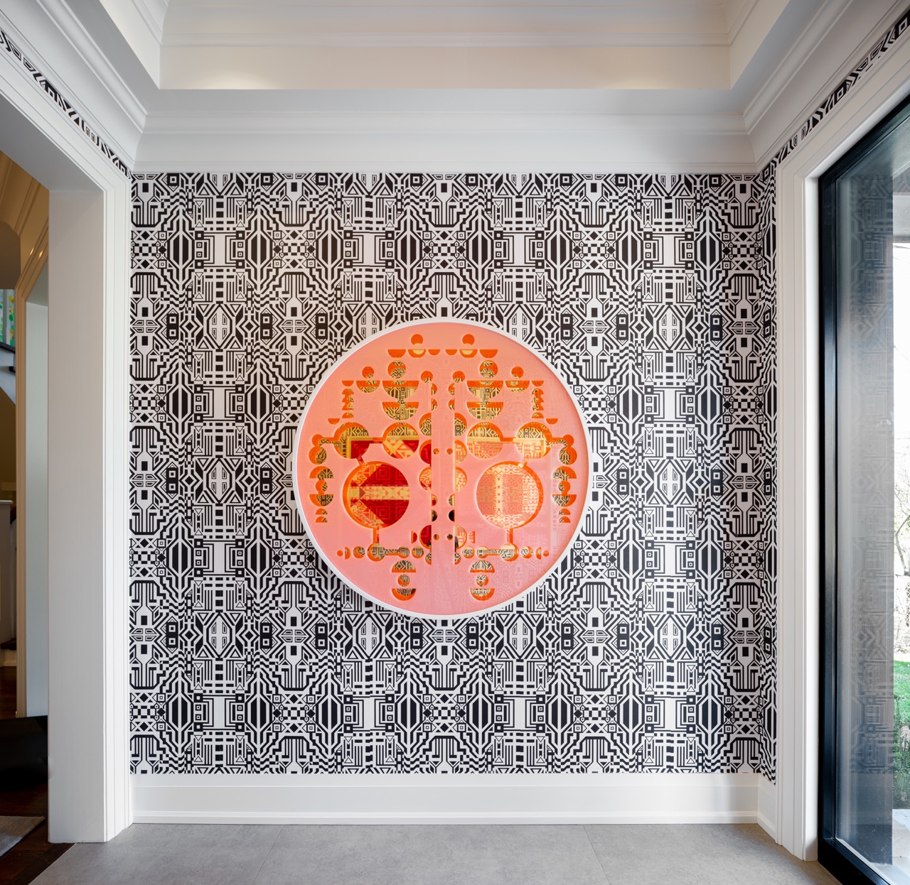 Stylish South Hill: Pops of citrus-toned art play off the warm wood tones, while polished stone flooring keeps the whole space grounded