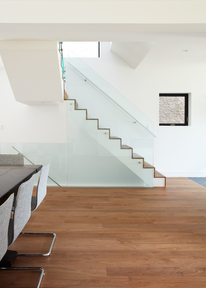 High Park: The walnut waterfall staircase and frameless glass helped complete the new space