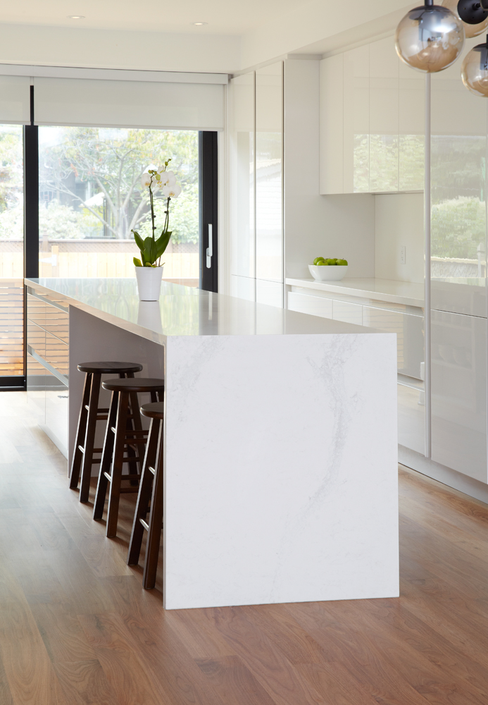 High Park: A combination of a modern kitchen with walnut flooring grounded the space