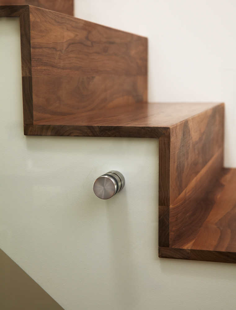 High Park: The walnut waterfall staircase and frameless glass helped complete the new space