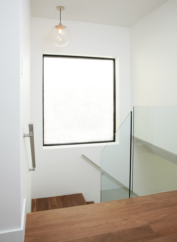 High Park: A combination of a modern kitchen with walnut flooring grounded the space