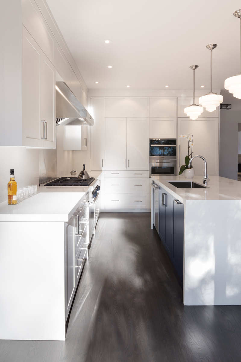 Sherwood Park: Features include heightened ceilings on the main, a light filled white and navy kitchen with a 14ft built in sofa for lounging and room for an 8 person dining table, and bar with a Moose rack no less!