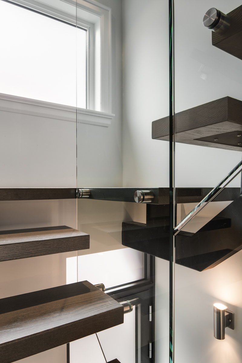 Sherwood Park: Features include heightened ceilings on the main, a light filled white and navy kitchen with a 14ft built in sofa for lounging and room for an 8 person dining table, and bar with a Moose rack no less!