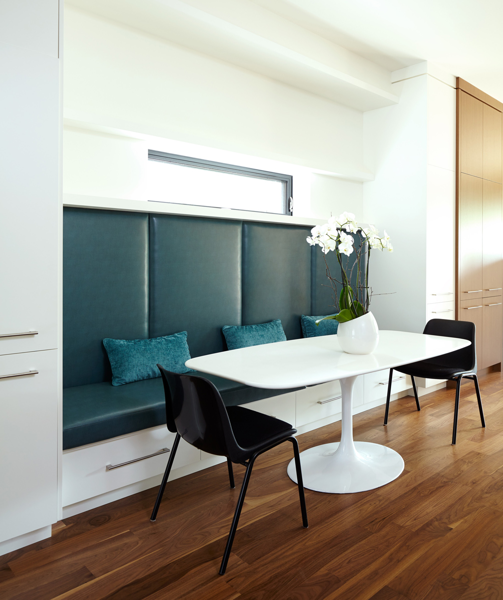 North Toronto Revived: Frameless glass stair guards, stainless steel handrails and door hardware, and natural stone tile selections accent the interior - while cedar, red brick and custom standing-seam black metal cladding are all integrated into…