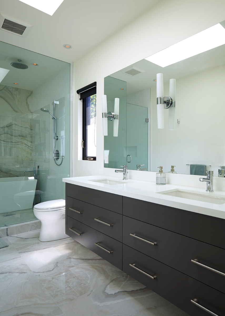 North Toronto Revived: Warm walnut floors and well thought out custom millwork serve to delineate the main floor areas and allow for ample storage space