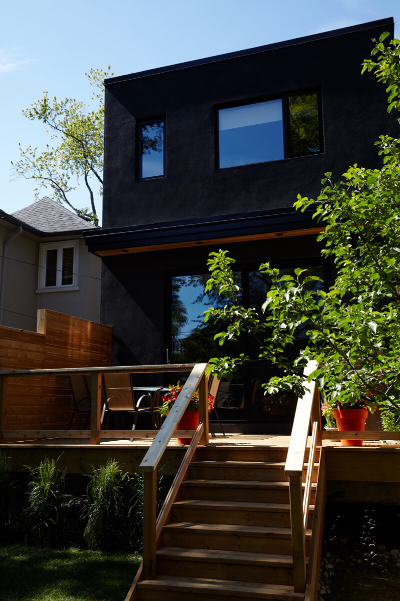 North Toronto Revived: Frameless glass stair guards, stainless steel handrails and door hardware, and natural stone tile selections accent the interior - while cedar, red brick and custom standing-seam black metal cladding are all integrated into…