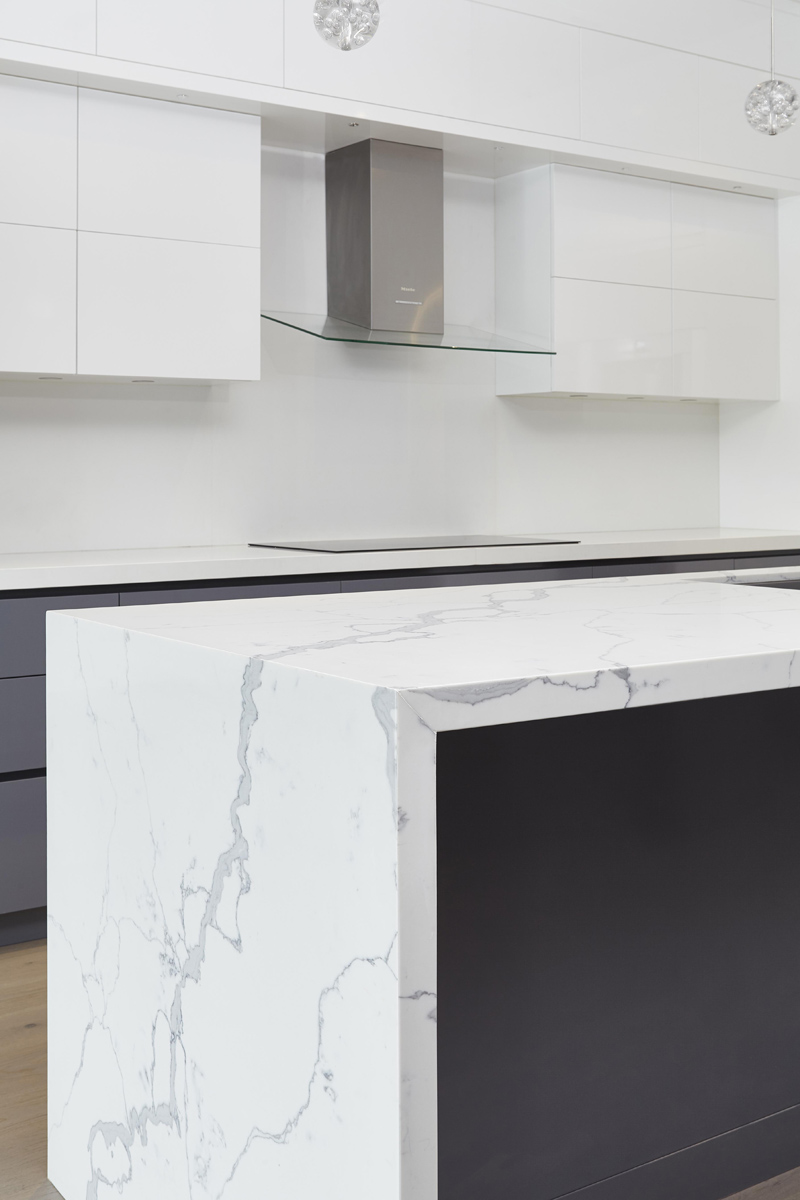 Swansea: Features included 14 ft ceilings on the main, high gloss kitchen millwork and a Caesarstone clad fireplace plus 22 ft curtain window for the living room