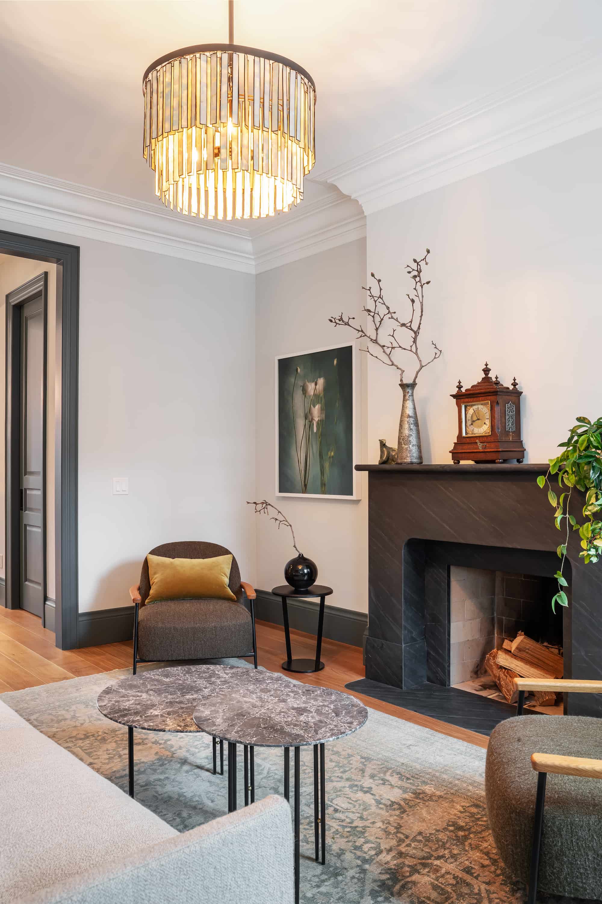 Astounding Annex: Open wood shelving, leather counter stools, and glass globe pendants keep the space feeling collected rather than showroom-new