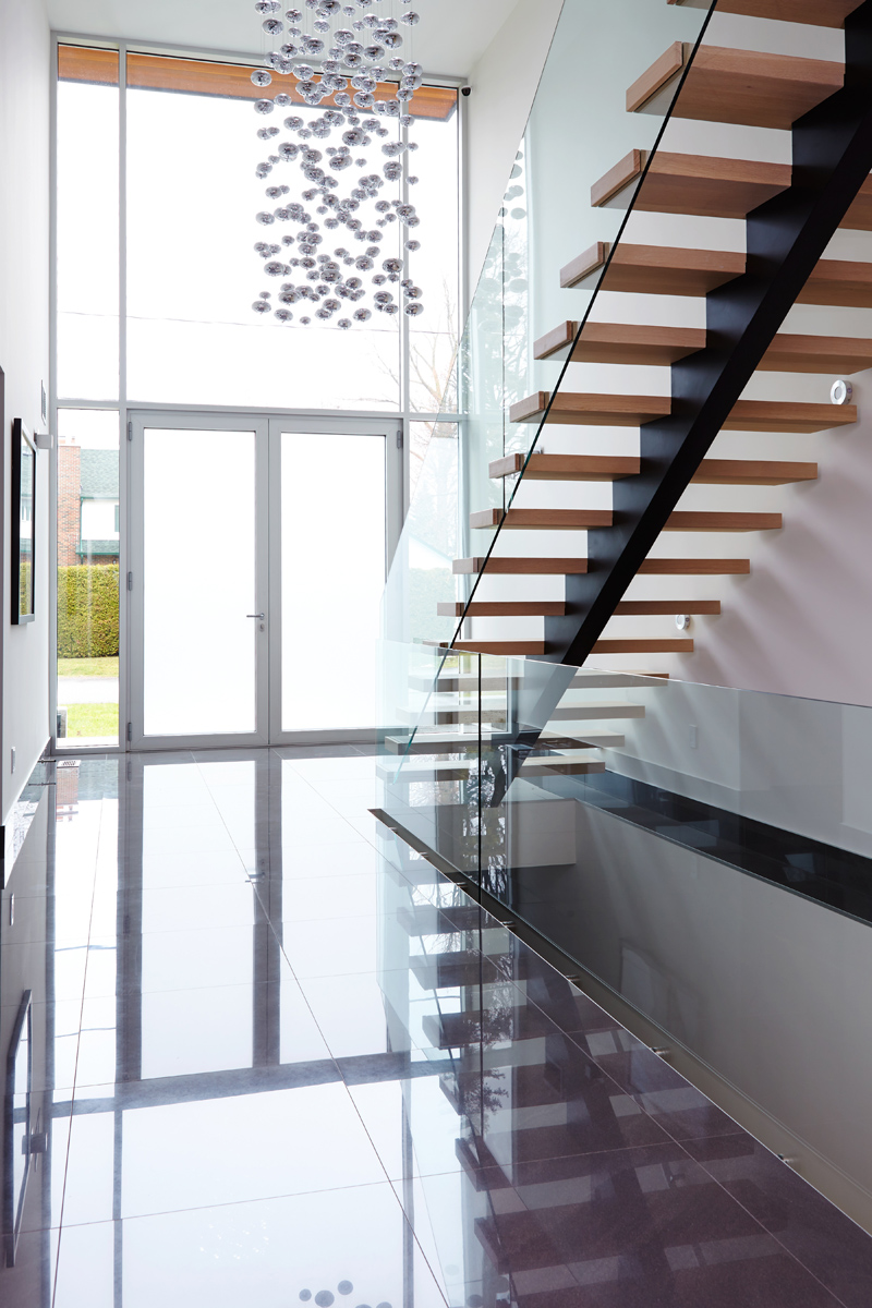Contemporary Living: Brand new custom home with soaring ceiling heights, towering windows, clean modern lines, and a Neff kitchen
