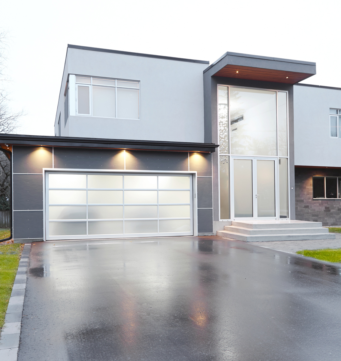 Contemporary Living: The exterior has a combination of cedar, stucco, and Hardi panel with anodized aluminum windows courtesy of Bigfoot