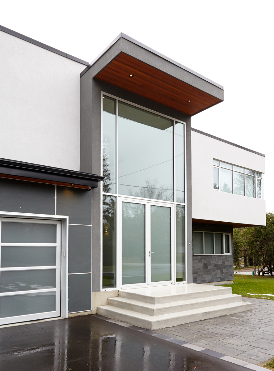 Contemporary Living: Brand new custom home with soaring ceiling heights, towering windows, clean modern lines, and a Neff kitchen