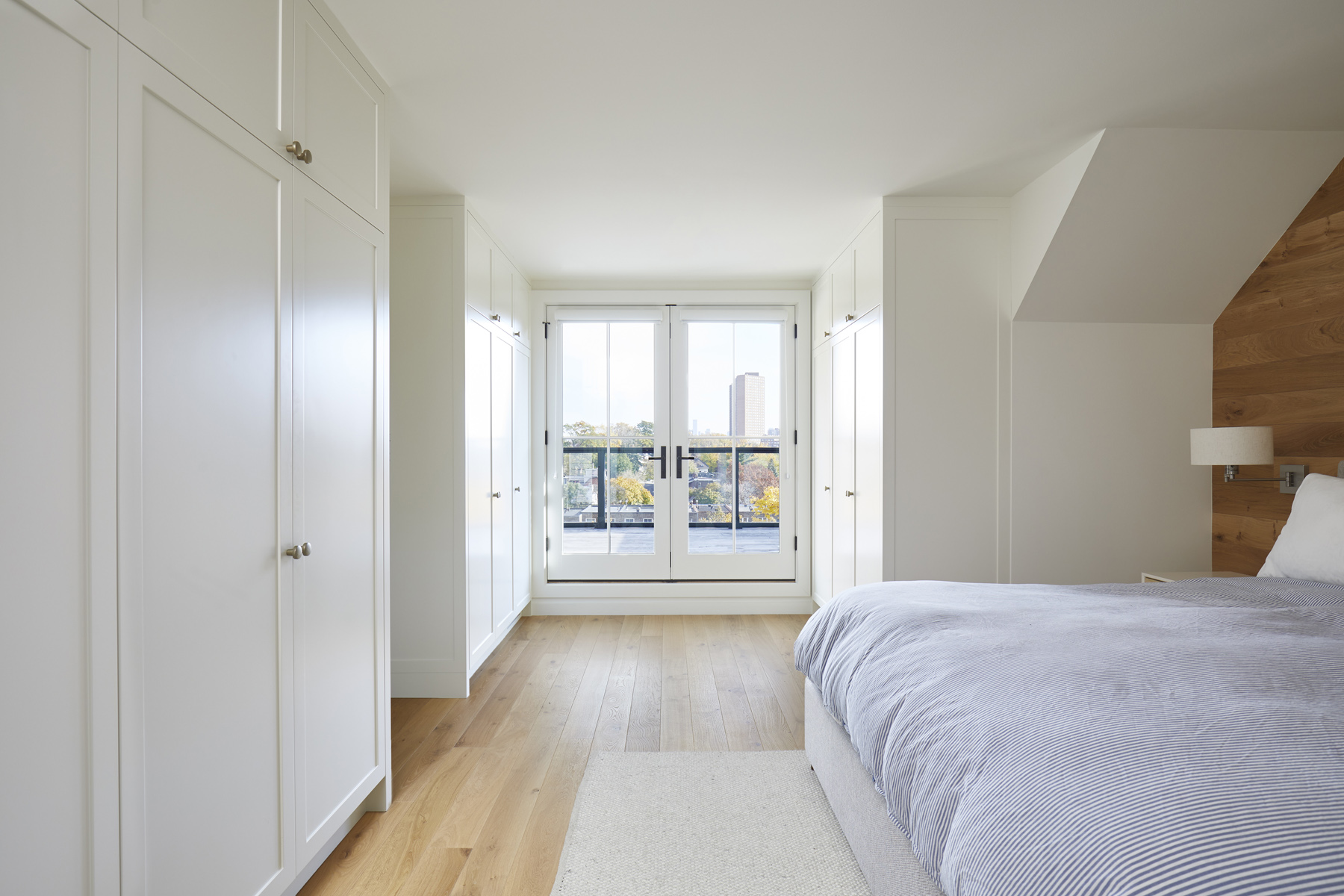 High Park-Swansea: A walk out rooftop deck overlooking the backyard and canopy of trees complements the space