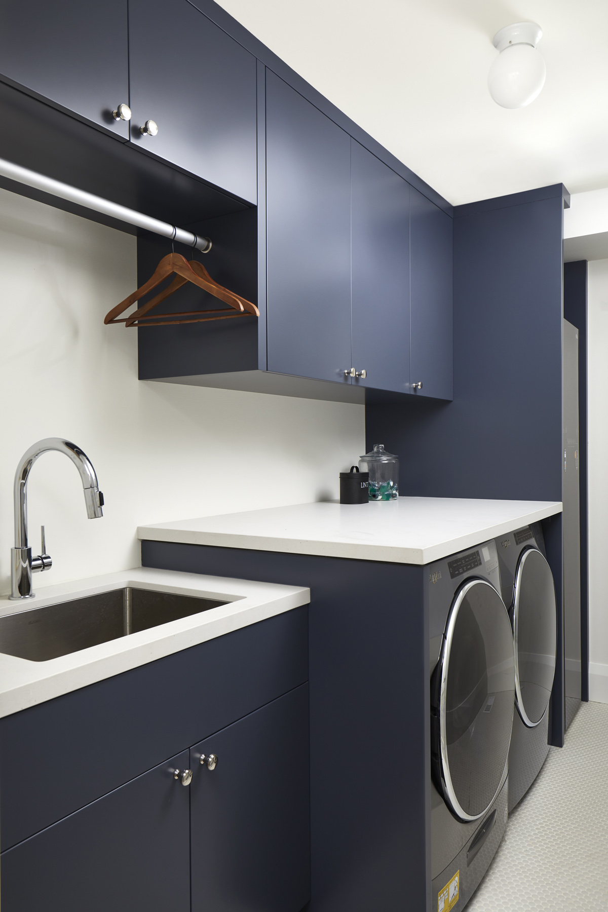 High Park-Swansea: The use of clever millwork continues on the second floor with the highly functional laundry room and customized closets for the children’s bedrooms