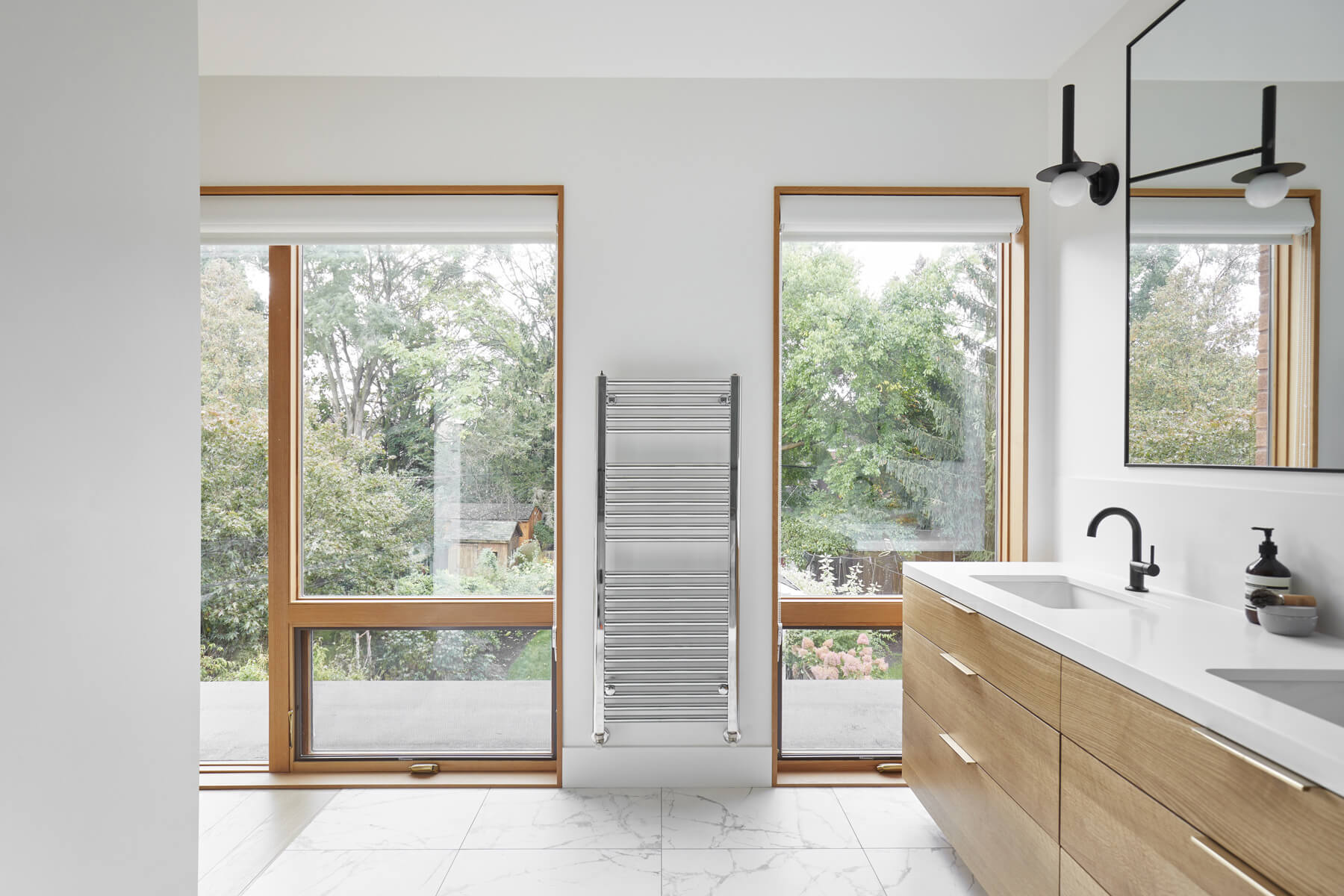 Roncesvalles Remodel: Now reclaimed as a single family home, the dwelling includes 4 bedrooms, 3 baths, a main floor mud room and an open, airy yoga retreat on the third floor with walkout deck and sweeping views of the backyard