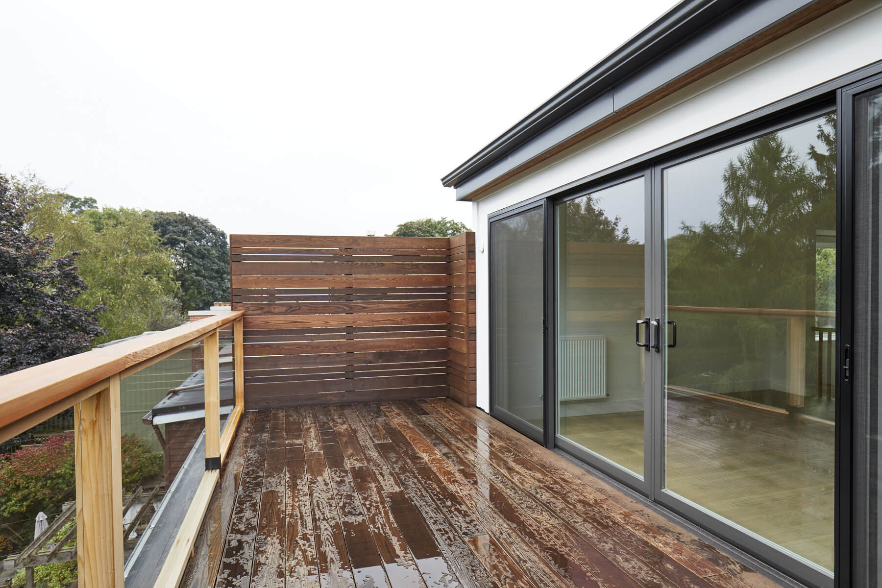 Roncesvalles Remodel: It features a curved leather banquette nestled in the bay window, floor to ceiling millwork with a full pantry, integrated appliances, panel ready Sub Zero and expansive storage