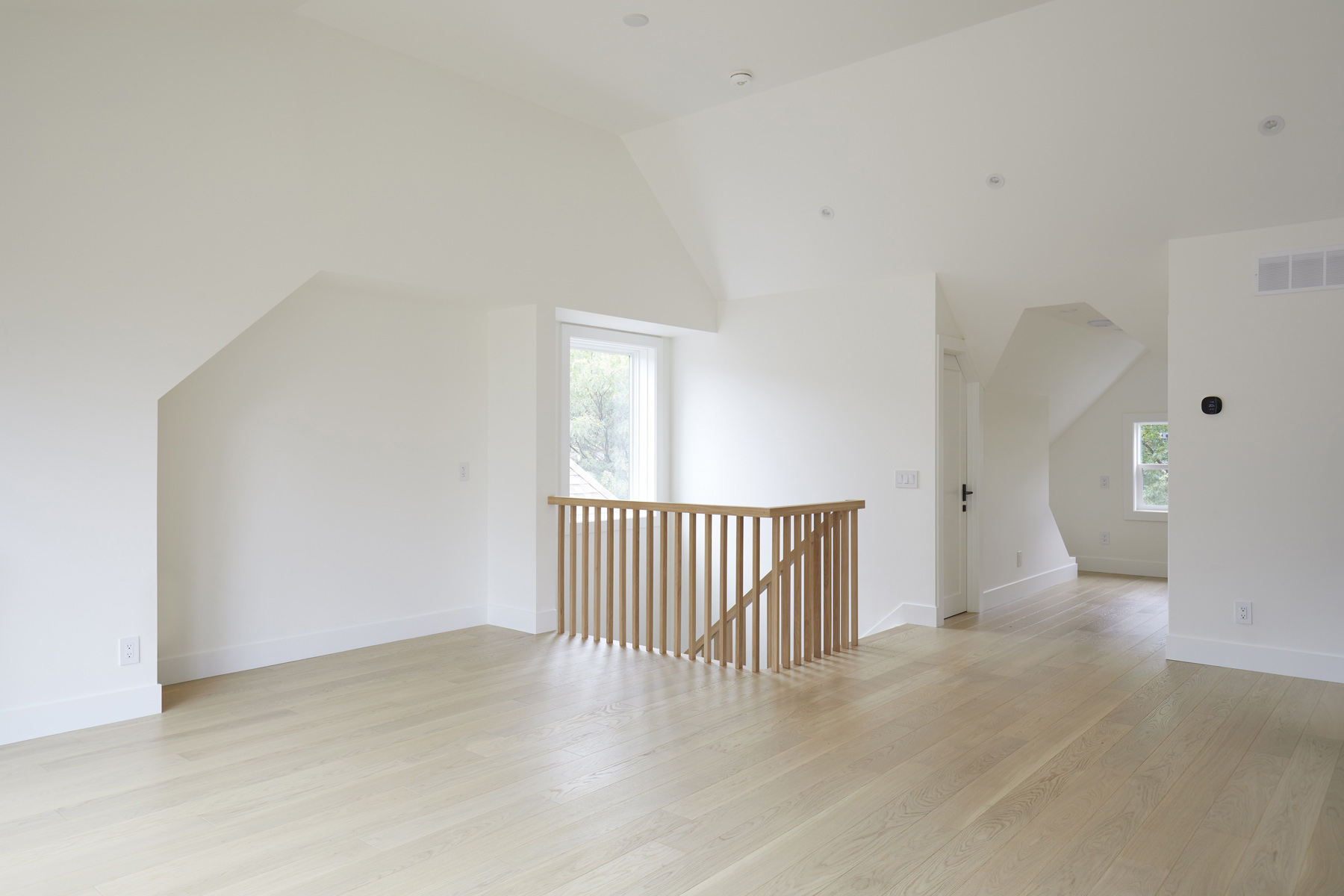 Roncesvalles Remodel: Now reclaimed as a single family home, the dwelling includes 4 bedrooms, 3 baths, a main floor mud room and an open, airy yoga retreat on the third floor with walkout deck and sweeping views of the backyard