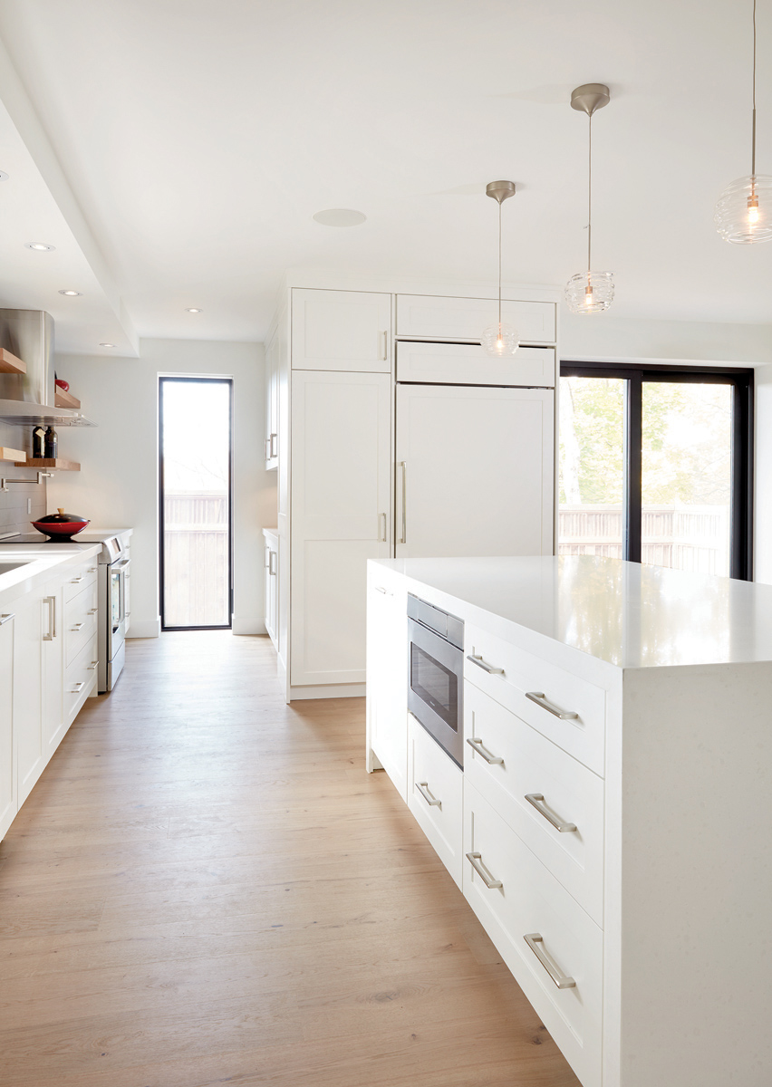 East York: Oiled oak flooring was paired with walnut accents and glass to allow for maximum warmth and light