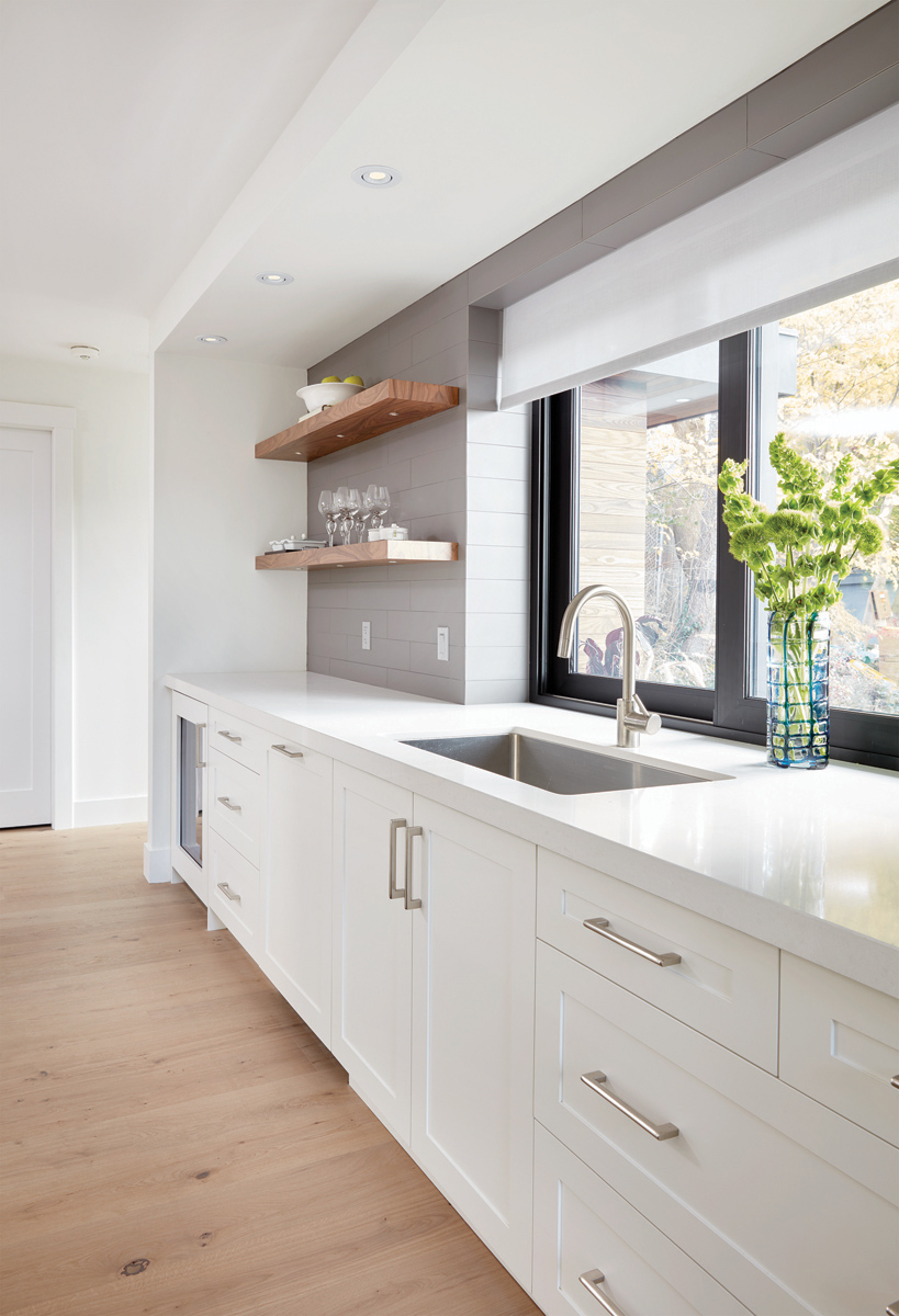 East York: Features included the use of Pizzara black slate, glass mosaic tile and Caesarstone