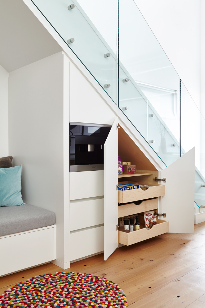 Urban Living Space: Special focus on spaces for art to hang in a gallery like setting, custom built-in storage where you might least expect it and the installation of an aluminum curtain wall window system