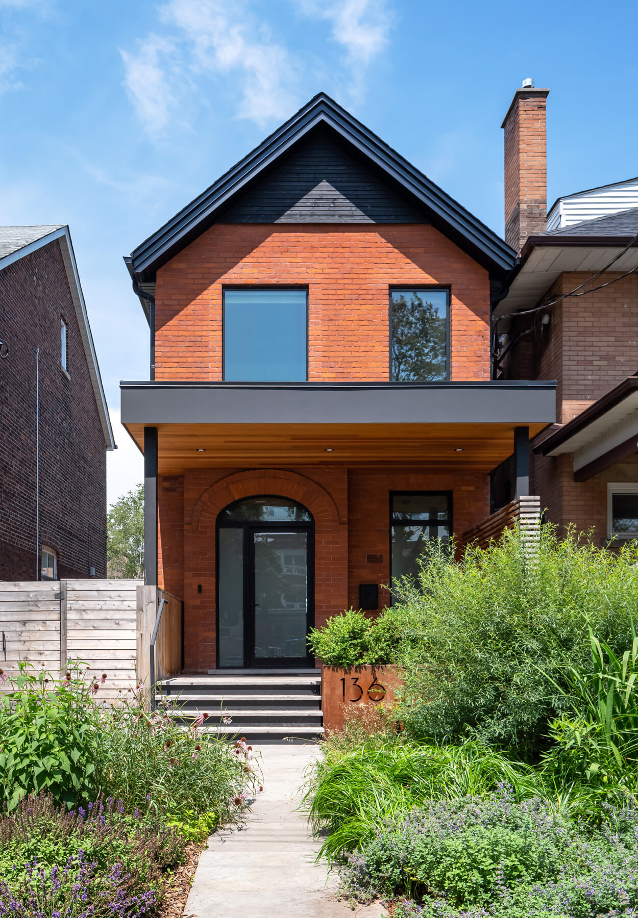 Roncesvalles Reno: Textures like exposed beams and geometric wild tiles give this home cool-kid elevation