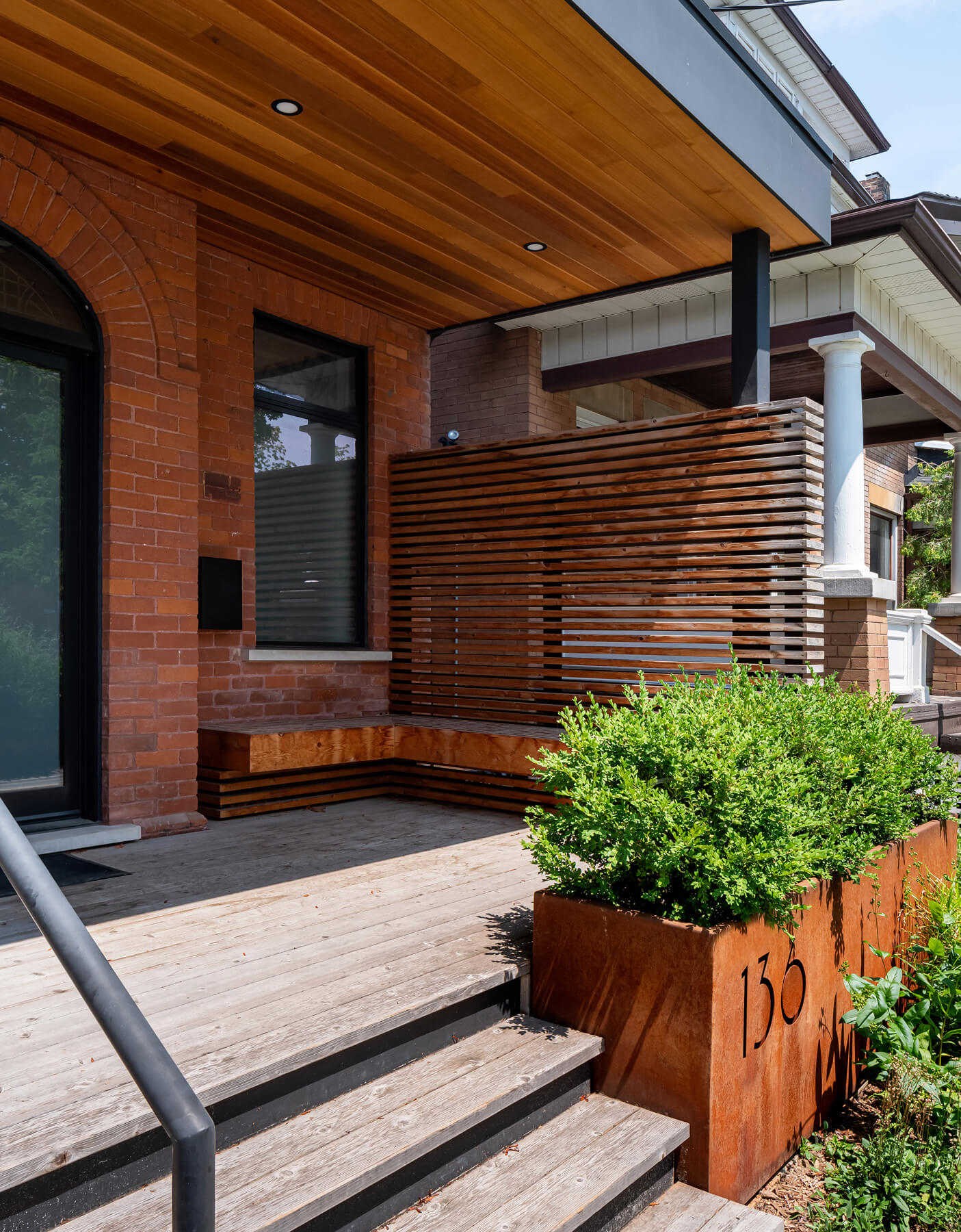 Roncesvalles Reno: The front of the house is reimagined with a fresh, new facade with a reimagined front porch and entrance