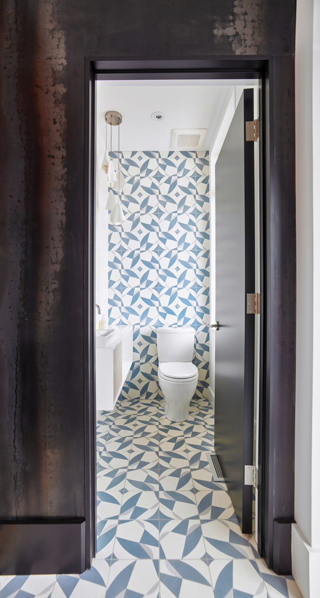 Roncesvalles Reno: A custom made barn door that repurposes scraps of reclaimed wood makes a bold statement on the 2nd floor, enclosing a small den space off the multi-use corridor, and in the basement, a custom built in shelving unit uses rough,…