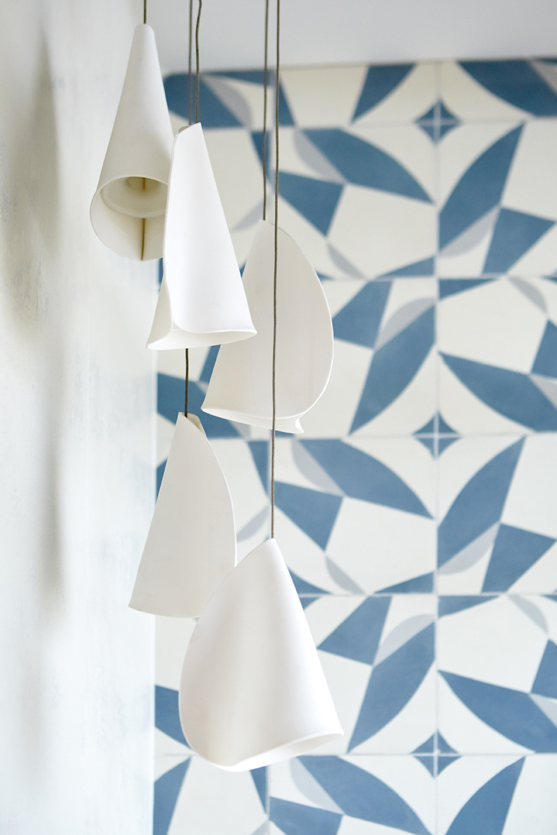 Roncesvalles Reno: Another standout is the custom lasercut screen features a pattern inspired by the kitchen backsplash tile