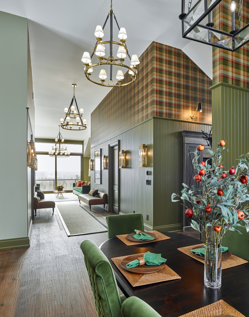 Country Retreat: The dark teal kitchen receives an injection of light from a thoughtfully-appointed skylight; a dining room with vaulted ceilings and bead board walls add a rustic feel