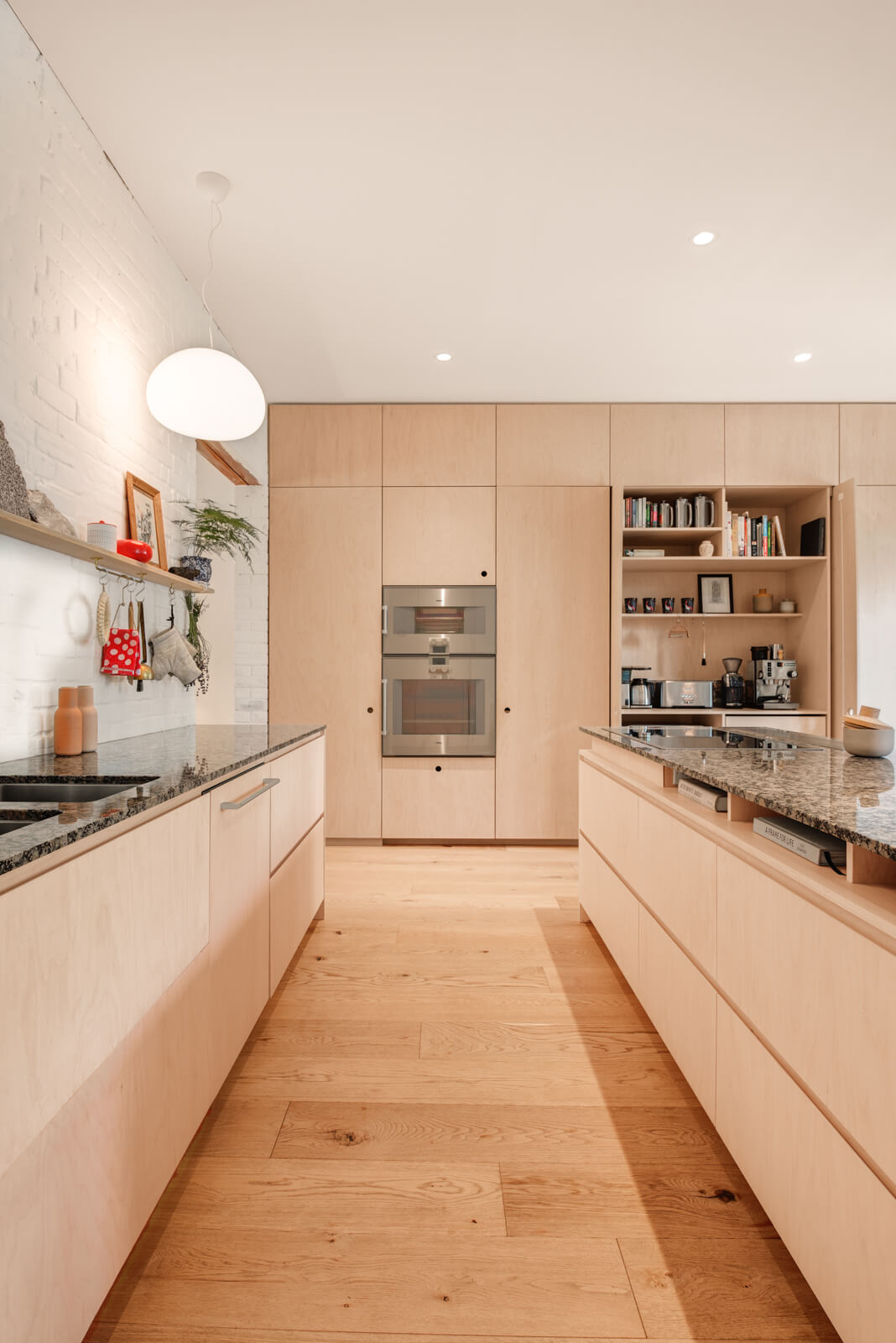Parkdale Project: Lime-washed brick, custom white oak railings, and solid maple doors and windows complimented the space and furnishings