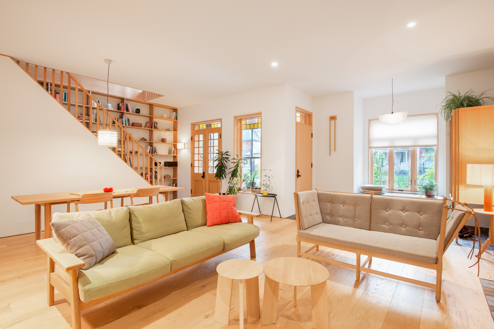 Parkdale Project: Lime-washed brick, custom white oak railings, and solid maple doors and windows complimented the space and furnishings