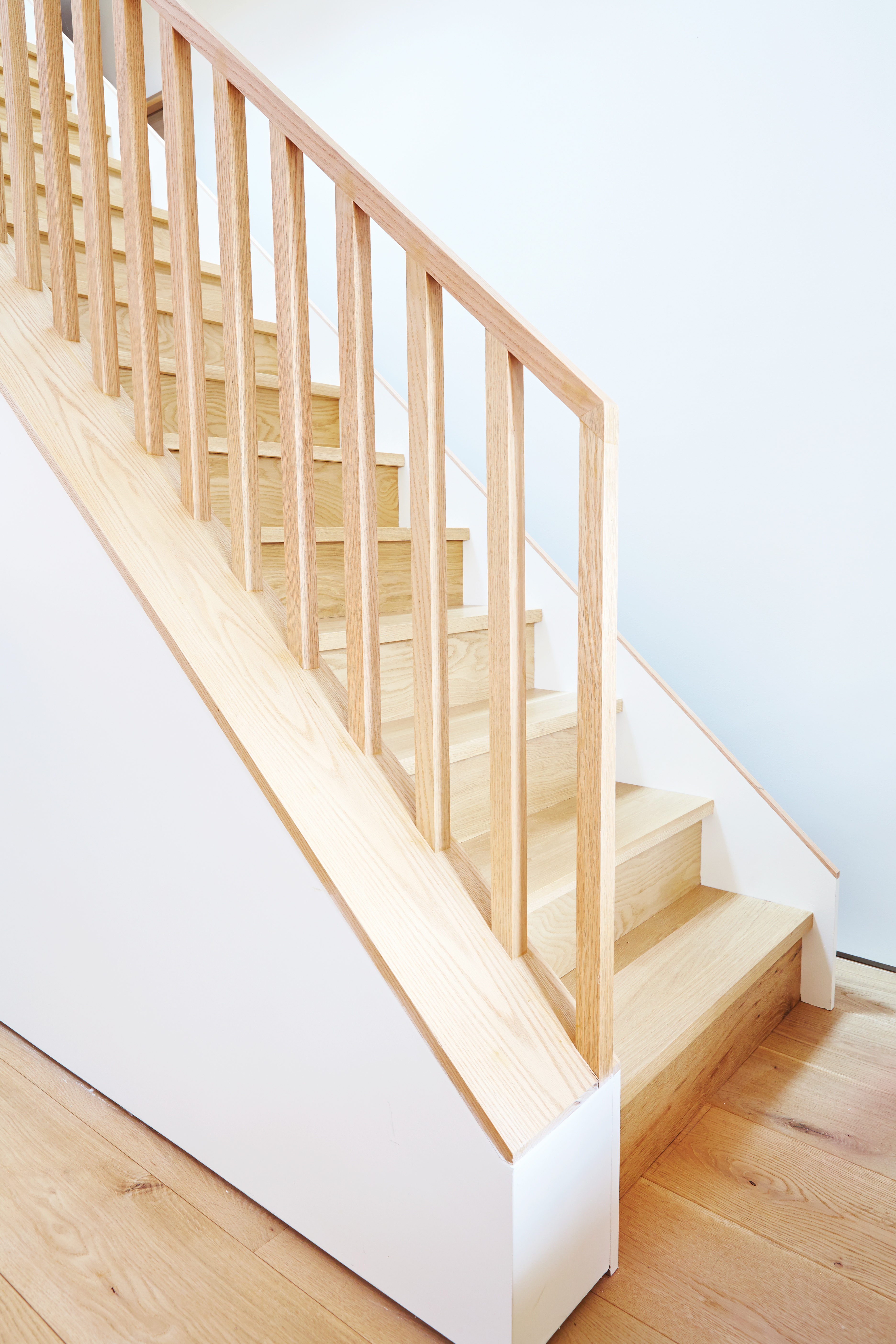 Parkdale Project: Lime-washed brick, custom white oak railings, and solid maple doors and windows complimented the space and furnishings