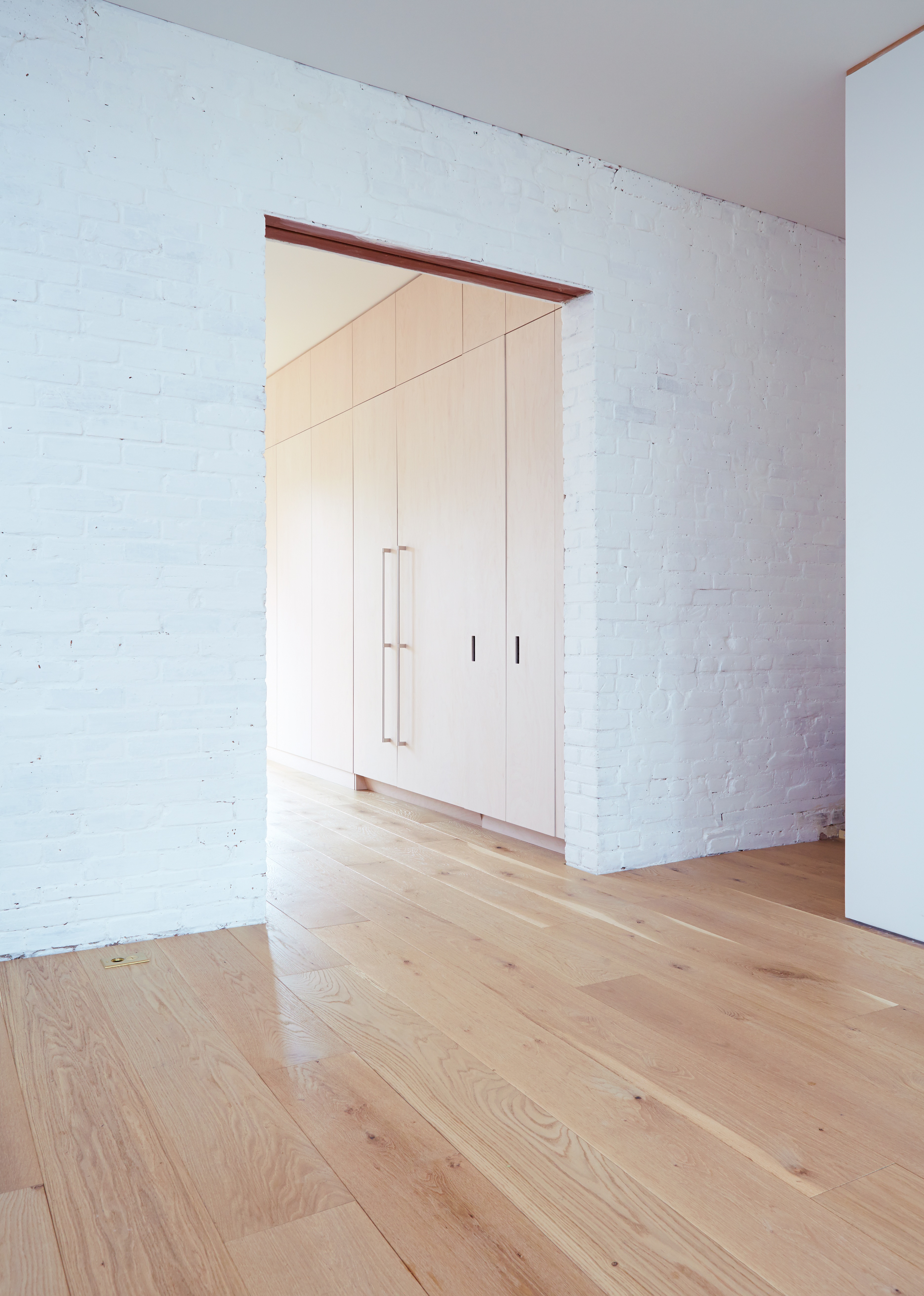 Parkdale Project: Oversized plank flooring and floor to ceiling oak cabinetry complimented the space