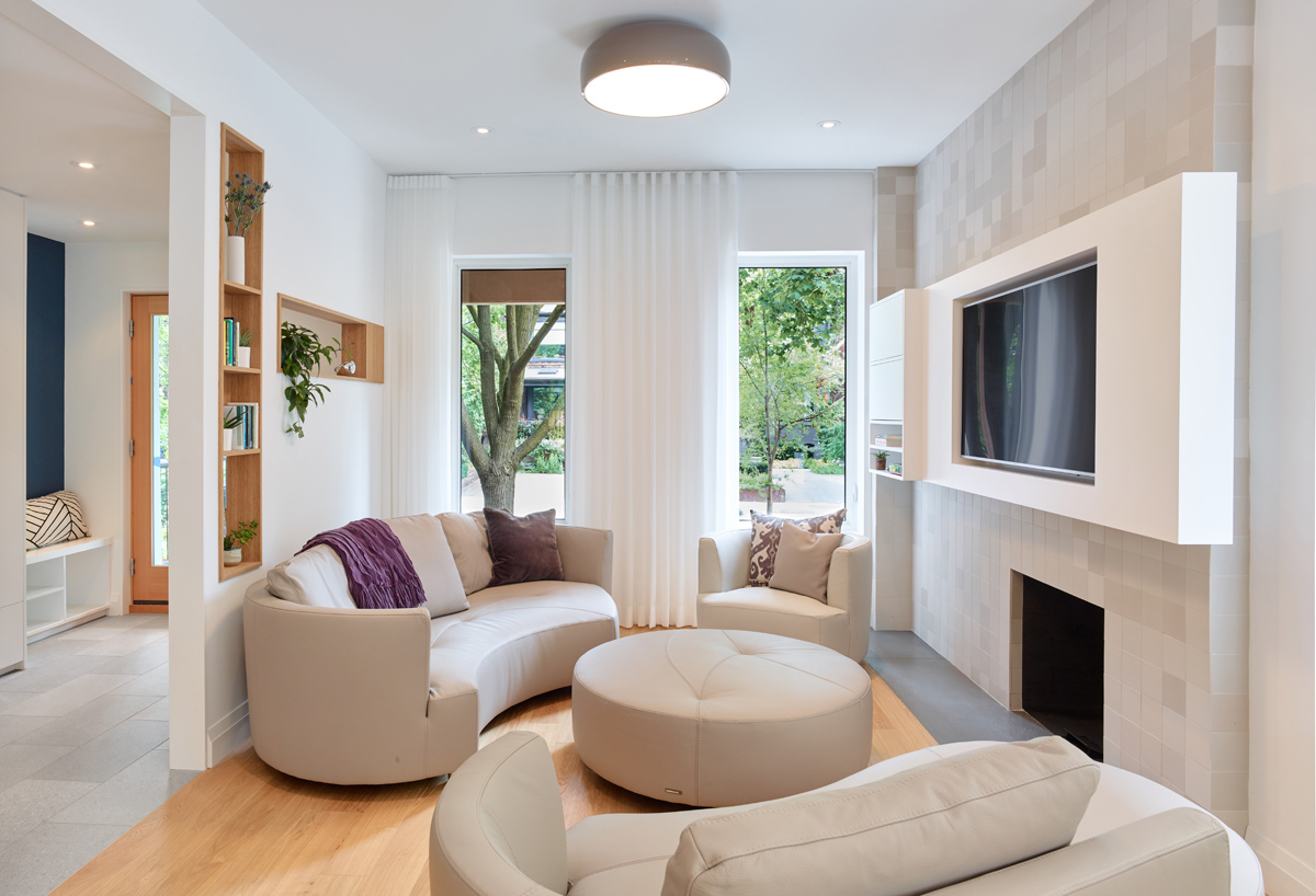 Awe-Inspiring Annex: The main living room at the front of the house is bright and airy, centred around a wood-burning fireplace and a floating media/TV unit