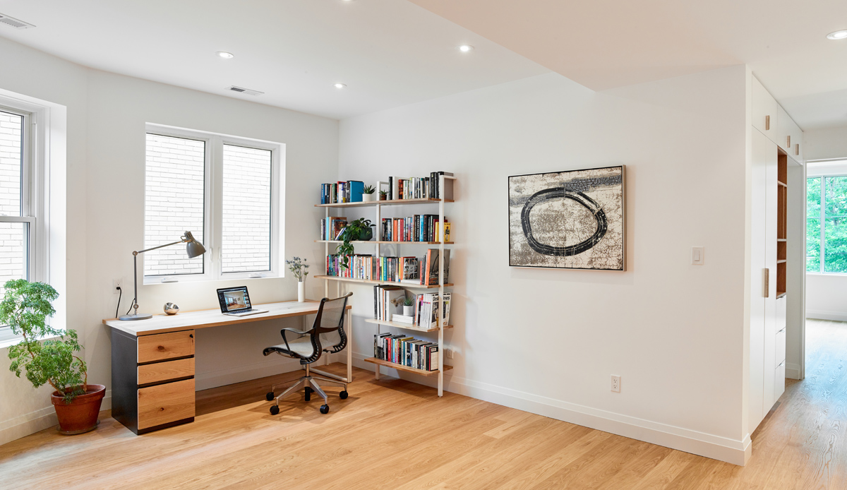 Awe-Inspiring Annex: The main living room at the front of the house is bright and airy, centred around a wood-burning fireplace and a floating media/TV unit