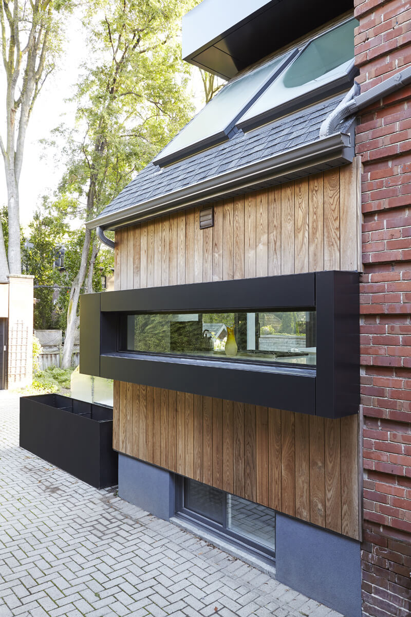 Summerhill Standout: The front half remained traditional while the back of the home was completely opened up and styled in a very modern aesthetic complete with huge windows, oversized skylights, custom exterior metal panels, and natural thermally…
