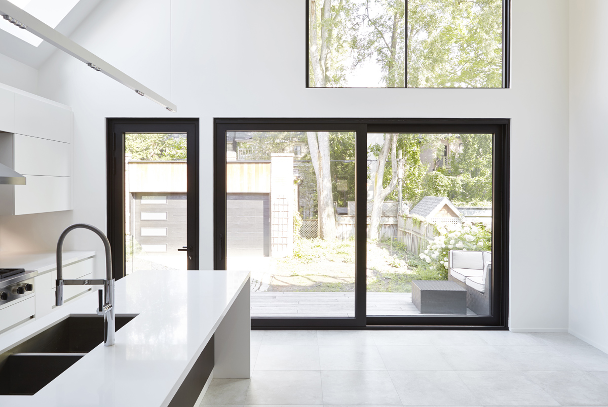 Summerhill Standout: The front half remained traditional while the back of the home was completely opened up and styled in a very modern aesthetic complete with huge windows, oversized skylights, custom exterior metal panels, and natural thermally…