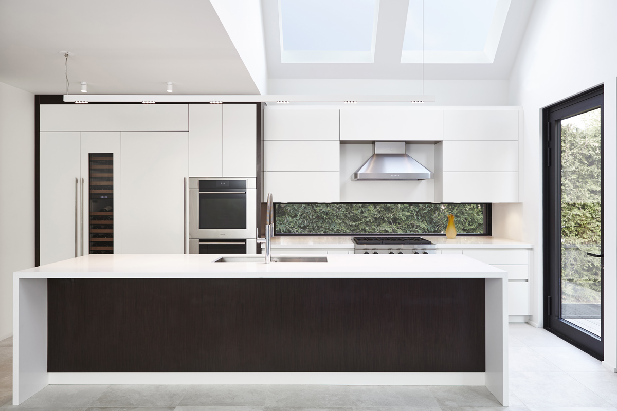 Summerhill Standout: The front half remained traditional while the back of the home was completely opened up and styled in a very modern aesthetic complete with huge windows, oversized skylights, custom exterior metal panels, and natural thermally…