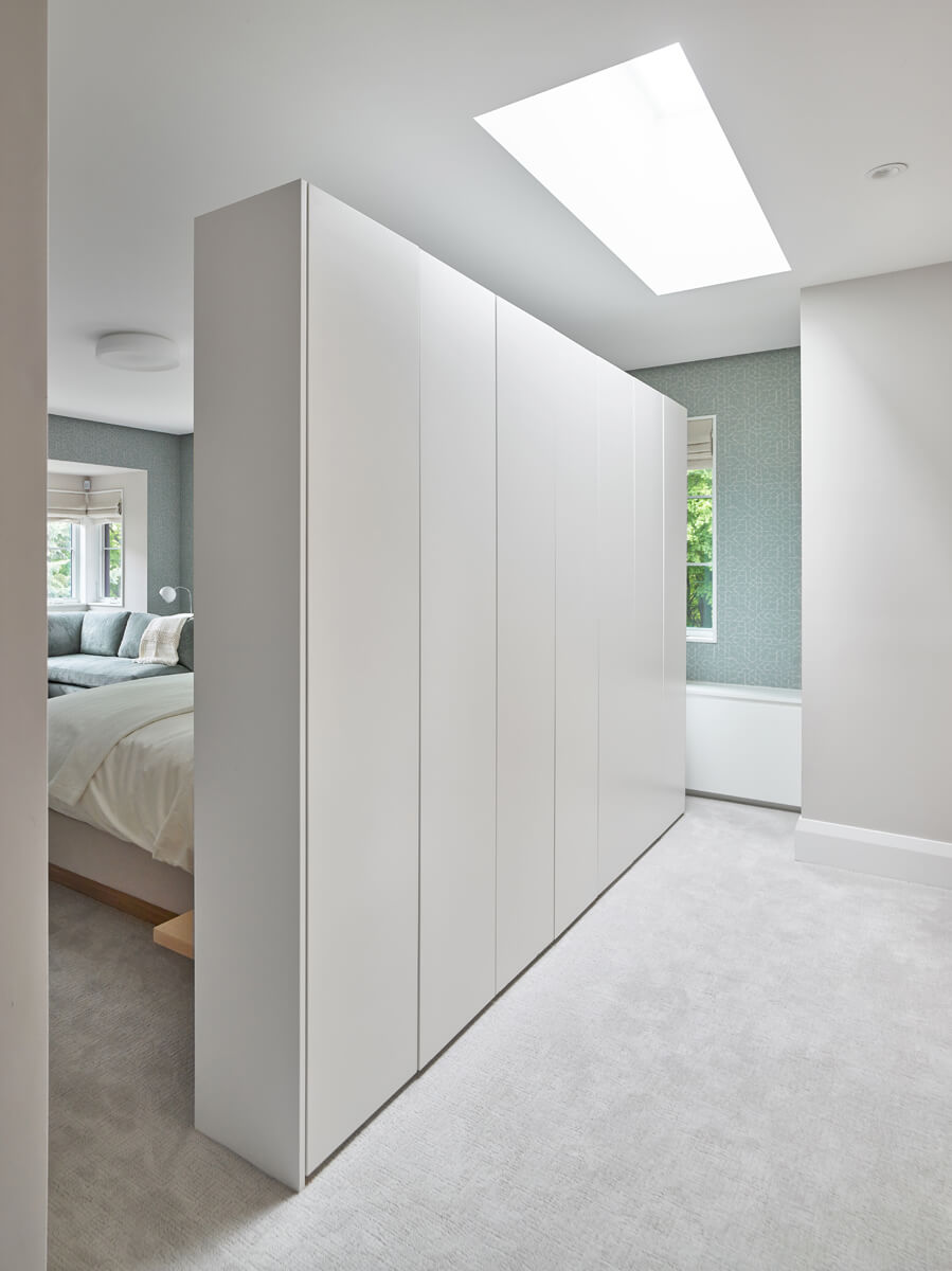 Beautiful Baby Point: The kitchen's crisp, clean palette is the perfect neutral foil for the handmade backsplash, and generous floor-to-ceiling windows provide a vista to the lush green yard and onto the Humber ravine